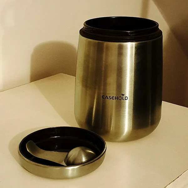 Airtight coffee container with scoop