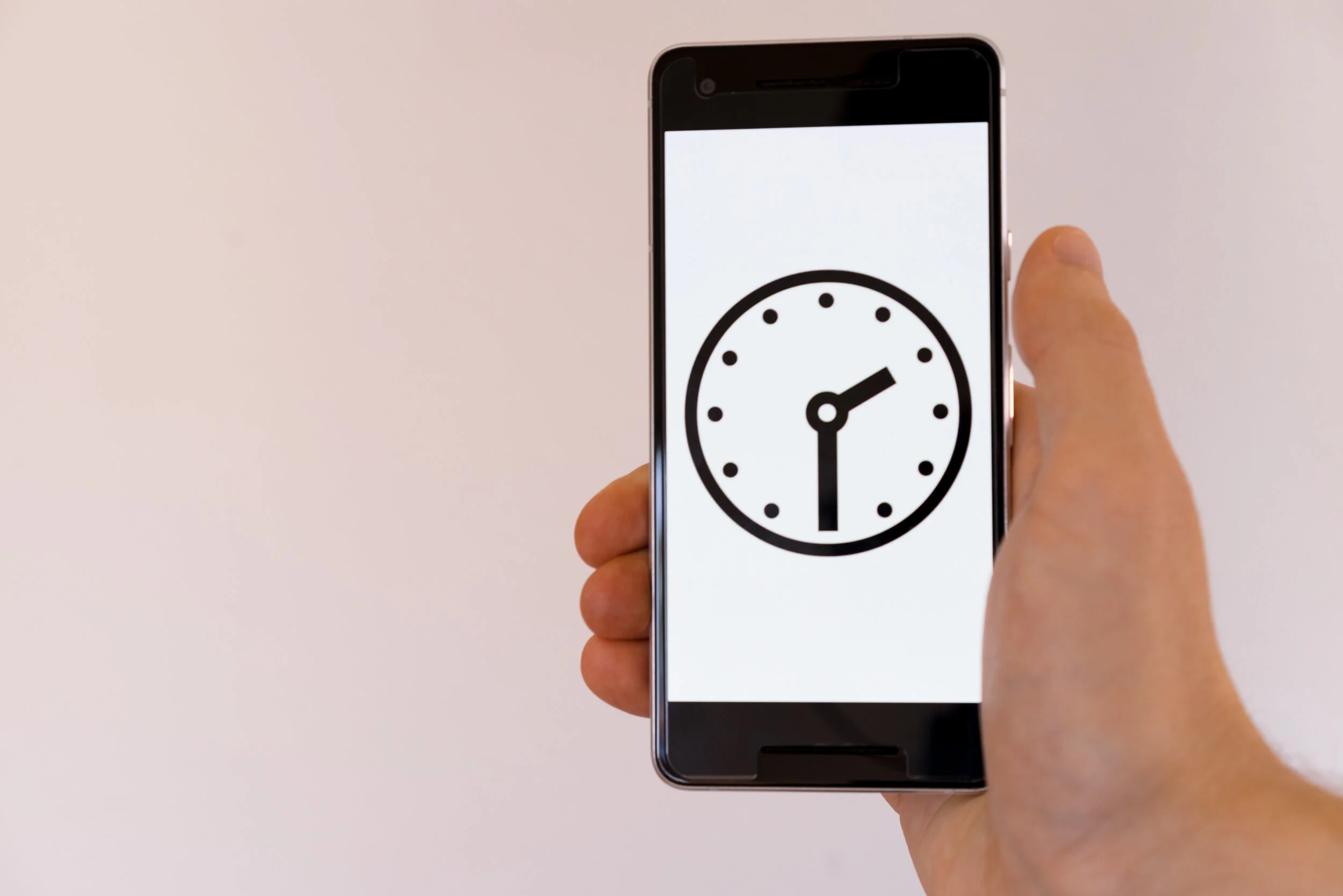 Phone In Hand Showing Clock Face