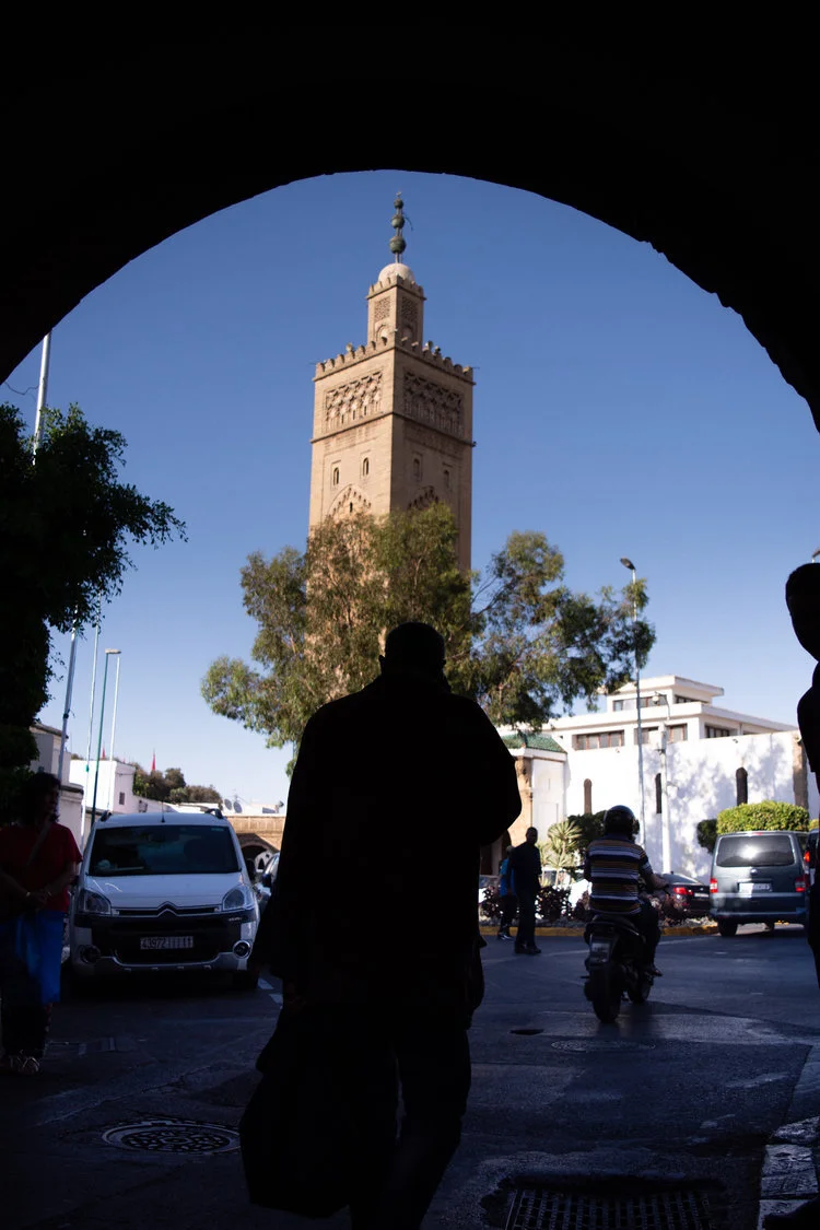 A man walks towards the Habous Mosque for afternoon prayer