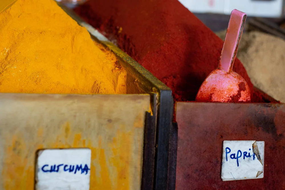 Containers of self-serve ground curcuma (turmeric) and paprika