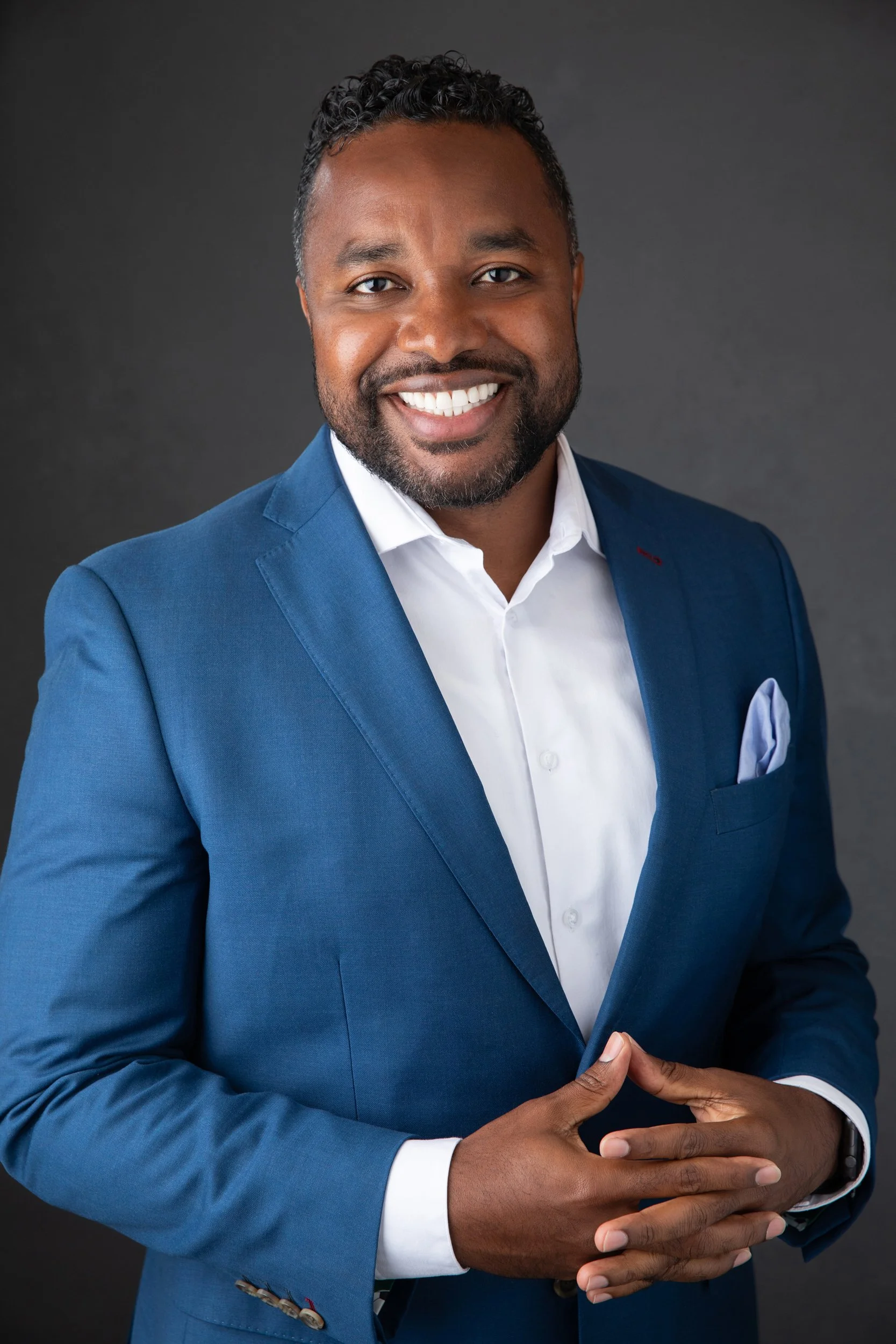 Executive headshot revealing a very confident look