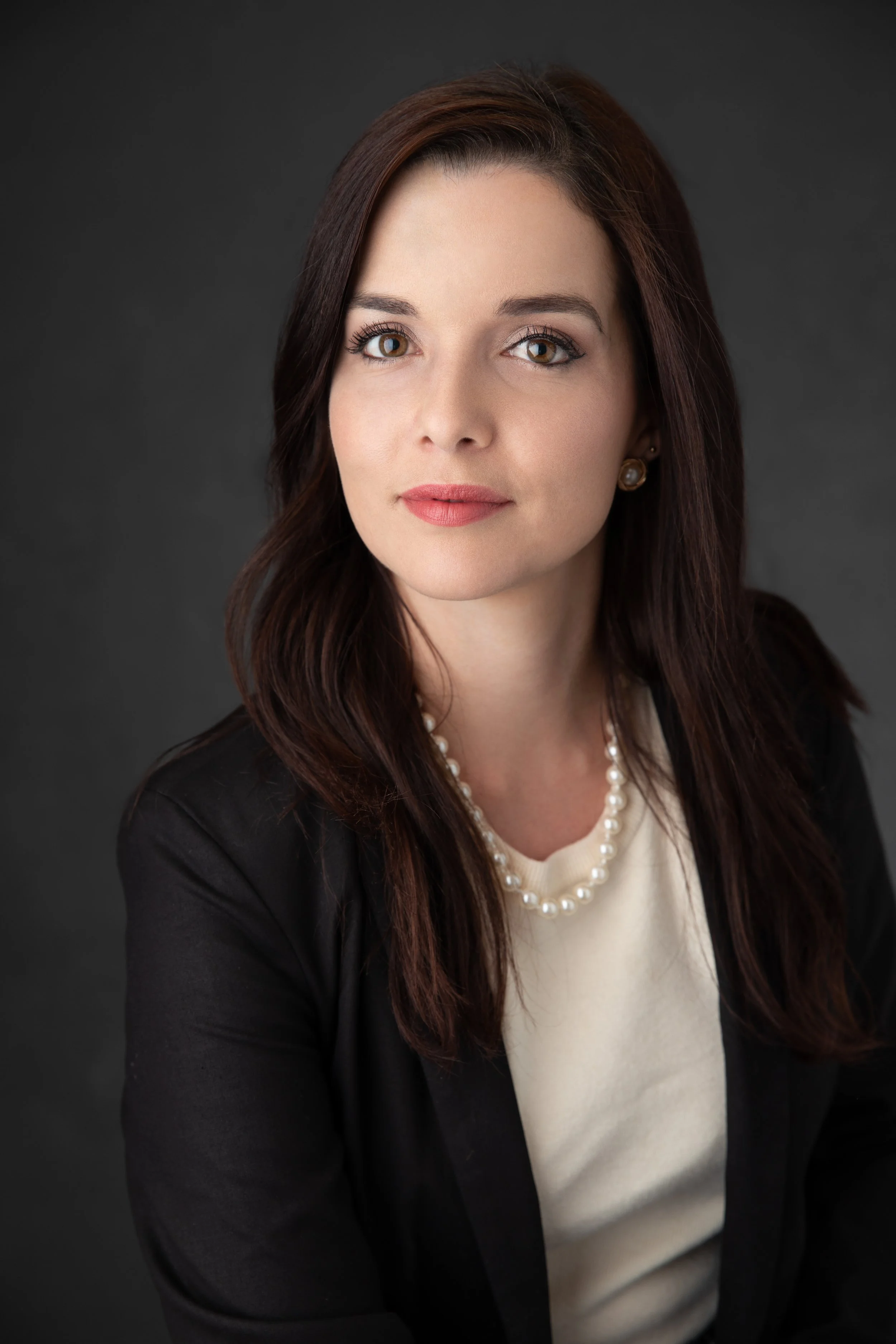 Woman's confident look for headshot session in Melville Ny.