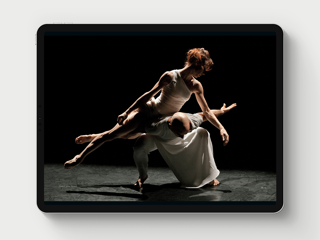 Two dancers balancing on one another.
