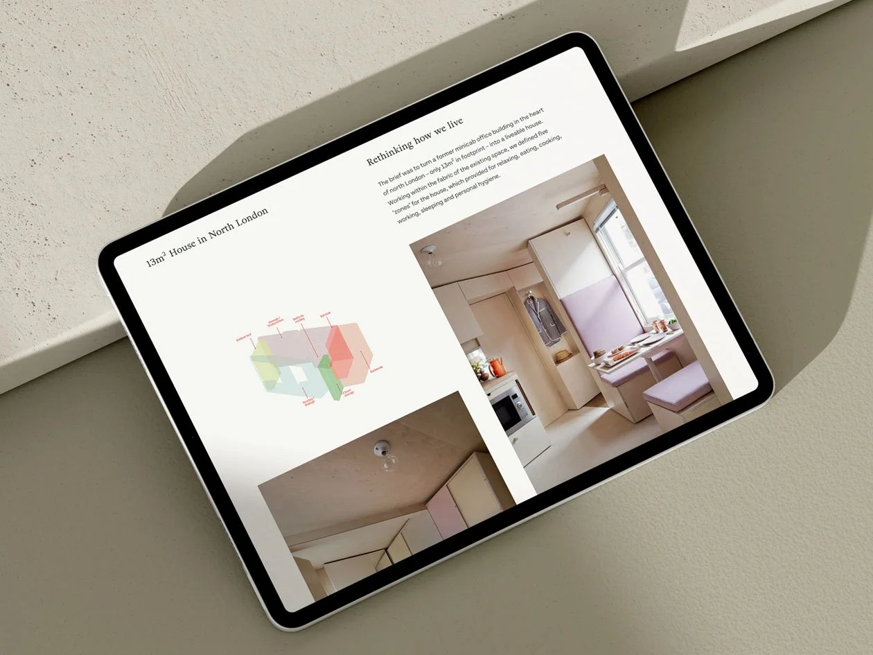An iPad displaying a real estate listing for a 13 square meter house in North London, showing floor plans and interior photos of a small, cozy kitchen and dining area.