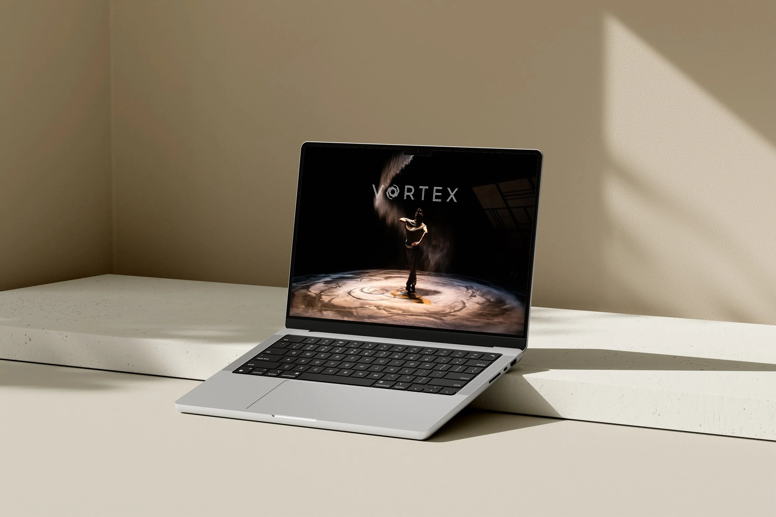Squarespace website design for Russell Maliphant Dance Company, displaying a performance still on a laptop screen