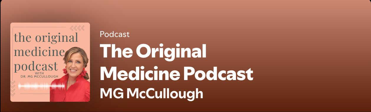 MG wearing a red shirt on a coral background