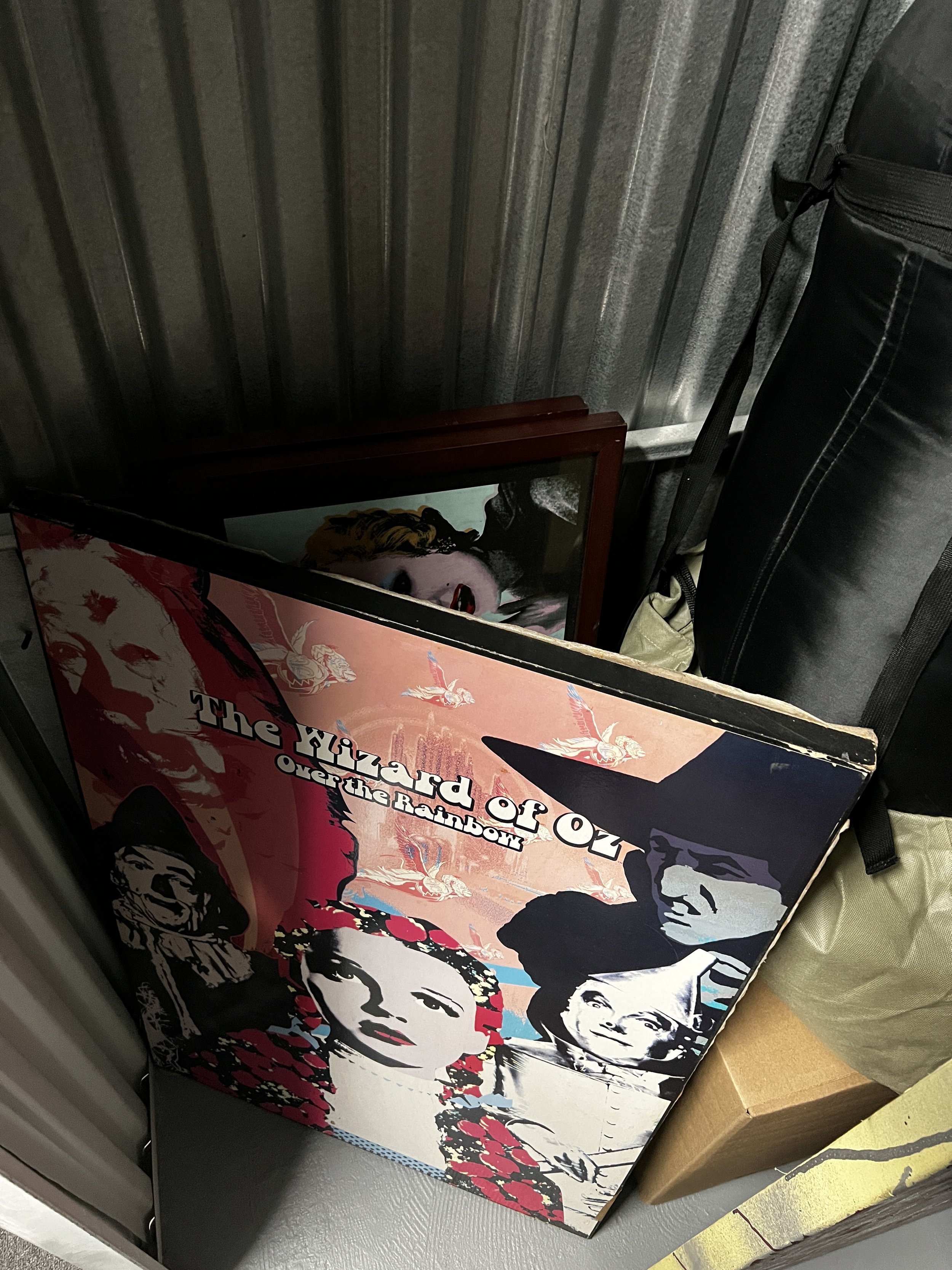 A vinyl record album cover for "The Wizard of Oz Over the Rainbow" with colorful illustrations of characters from the movie, including Dorothy and others.