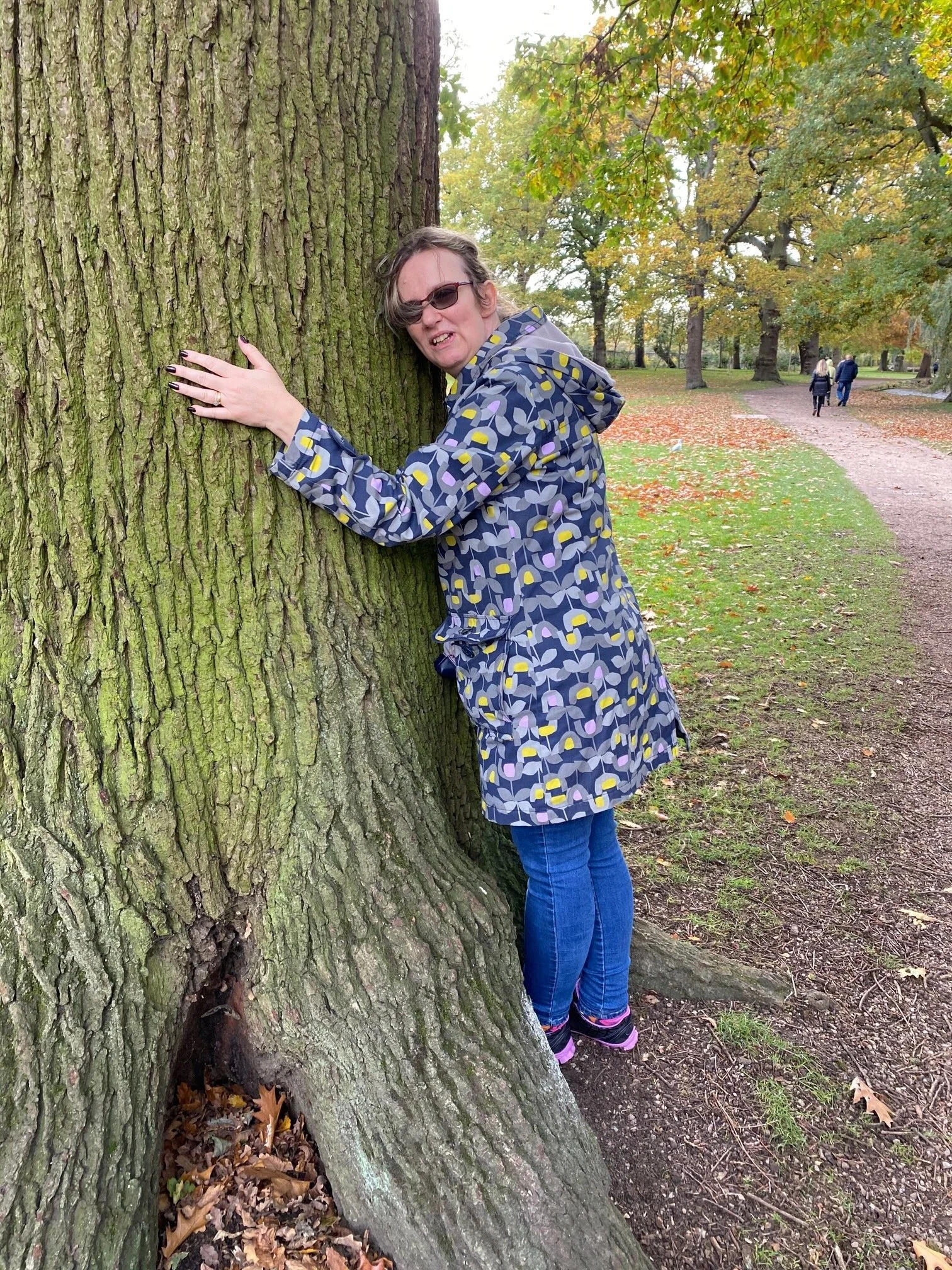 Sarah hugging a tree