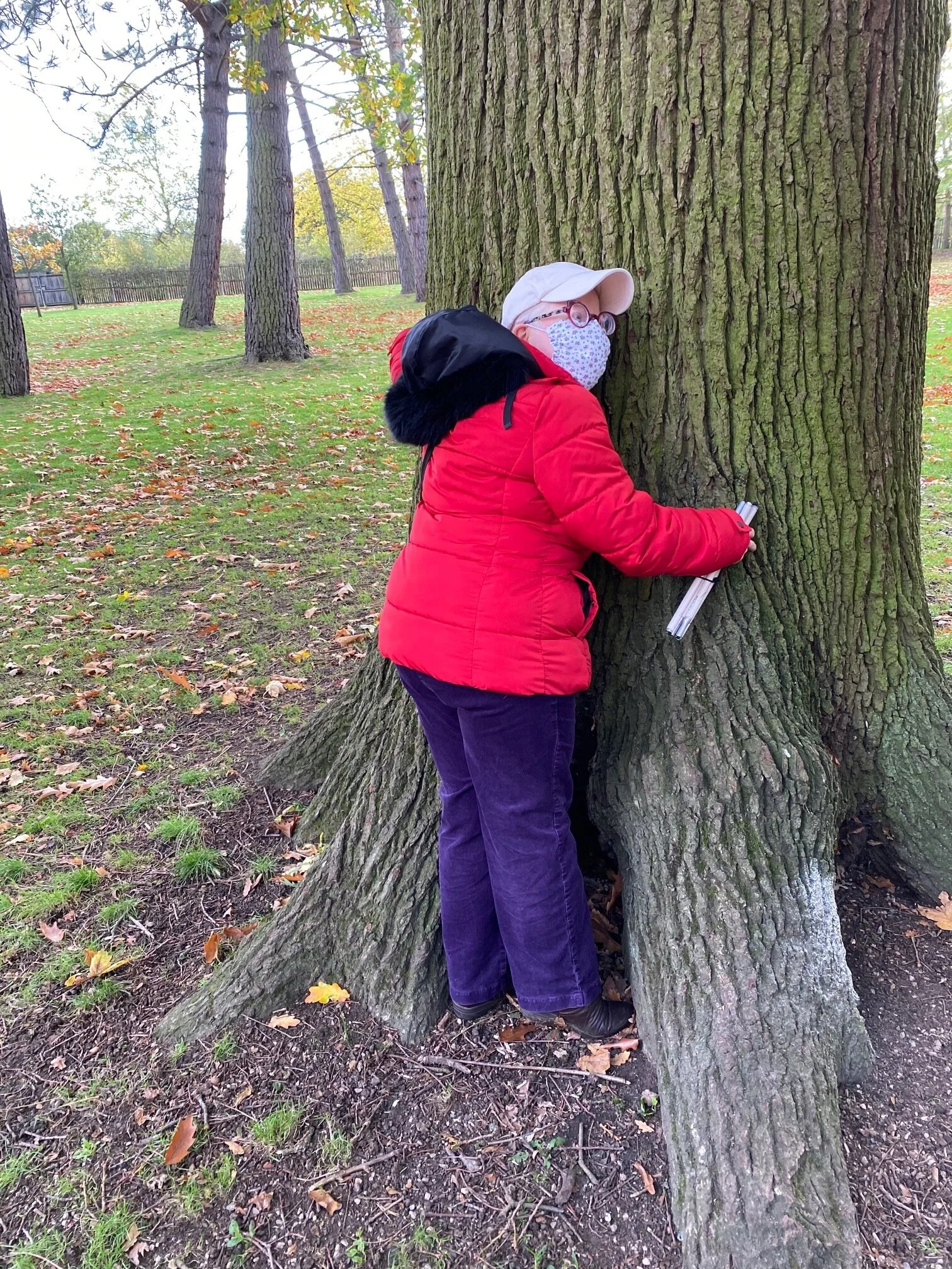 Carol hugging a tree