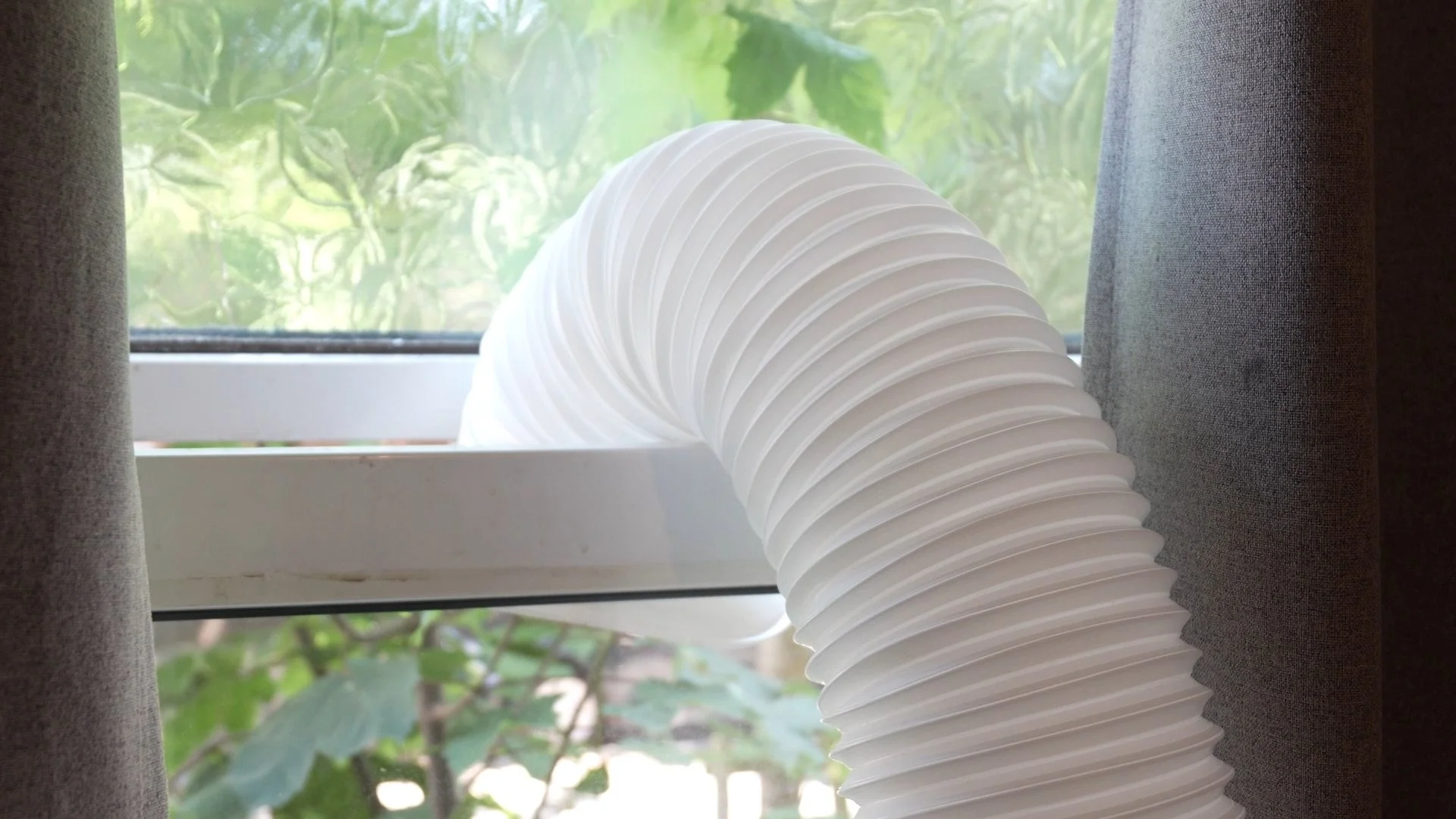 air con unit tube outside window