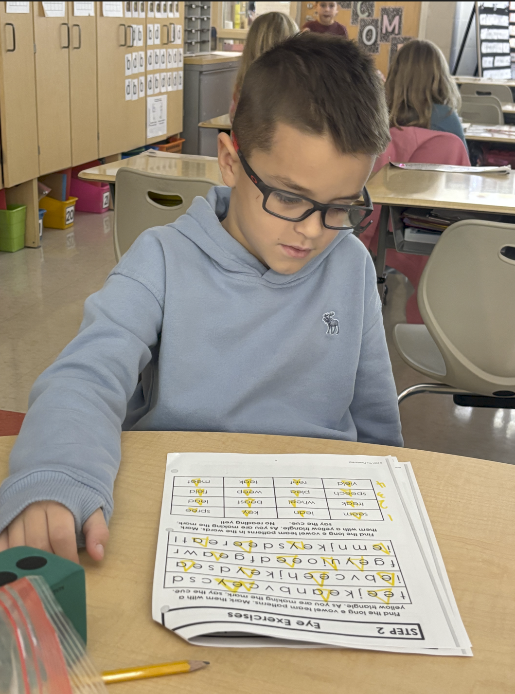 boy completing Phonics Wall Worksheet