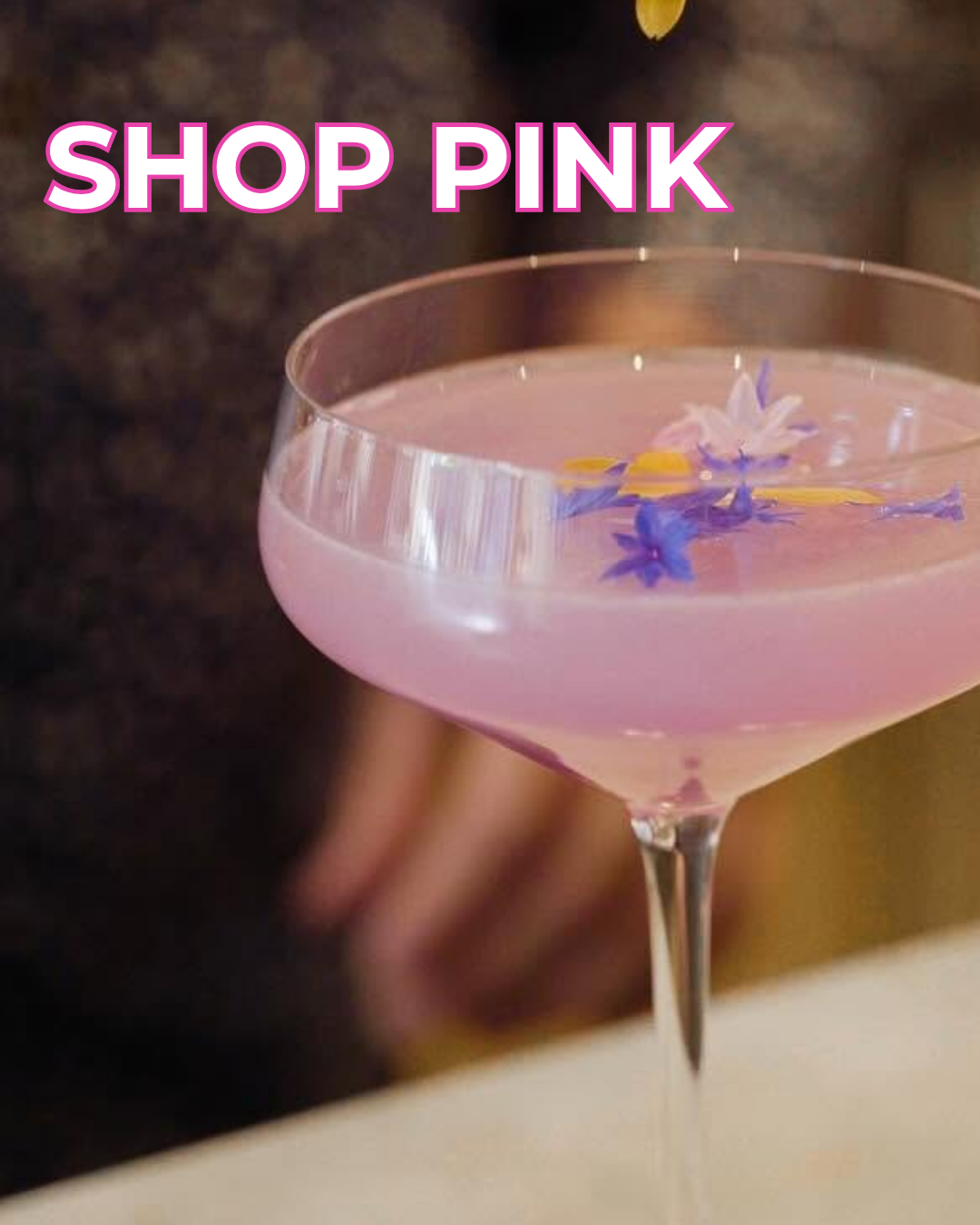 Pink cocktail with text overlay saying "shop pink"