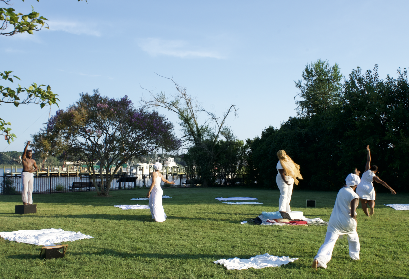 image of the dance group Make memory move on the custom house lawn, june 2025