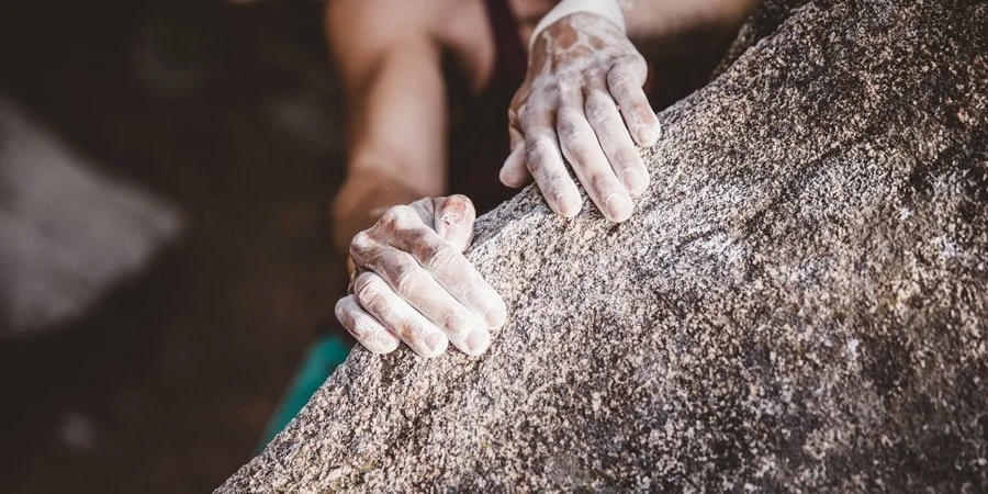 content_team_091718_0054_rock_climbing_hands_on_rock.jpg