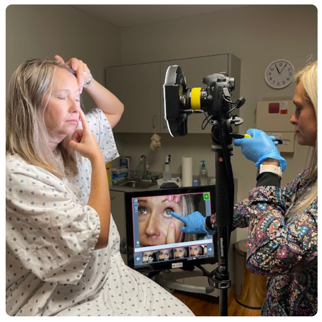 Nurse examining eye injuries to woman.