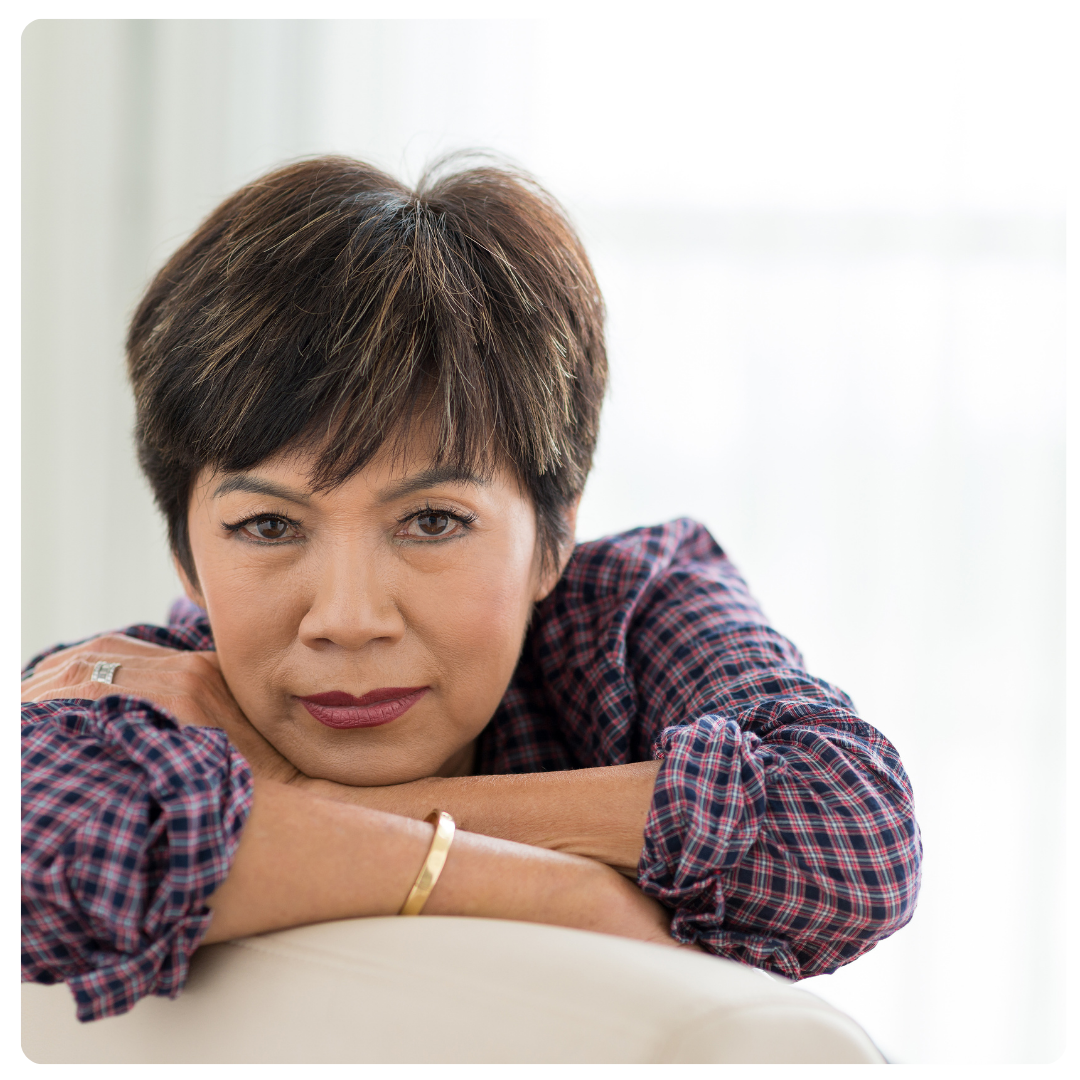 Woman without expression looking at camera.