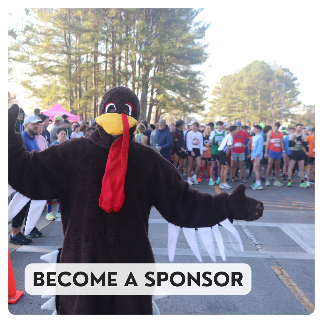 Become a sponsor: person in turkey costume stands in front of runners at Turkey Trot