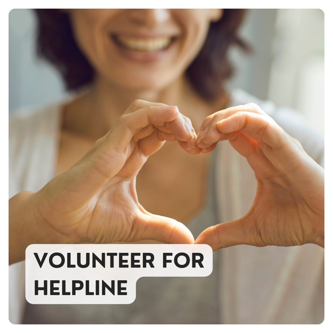 Volunteer for HELPline text on top of smiling woman making heart with hands.
