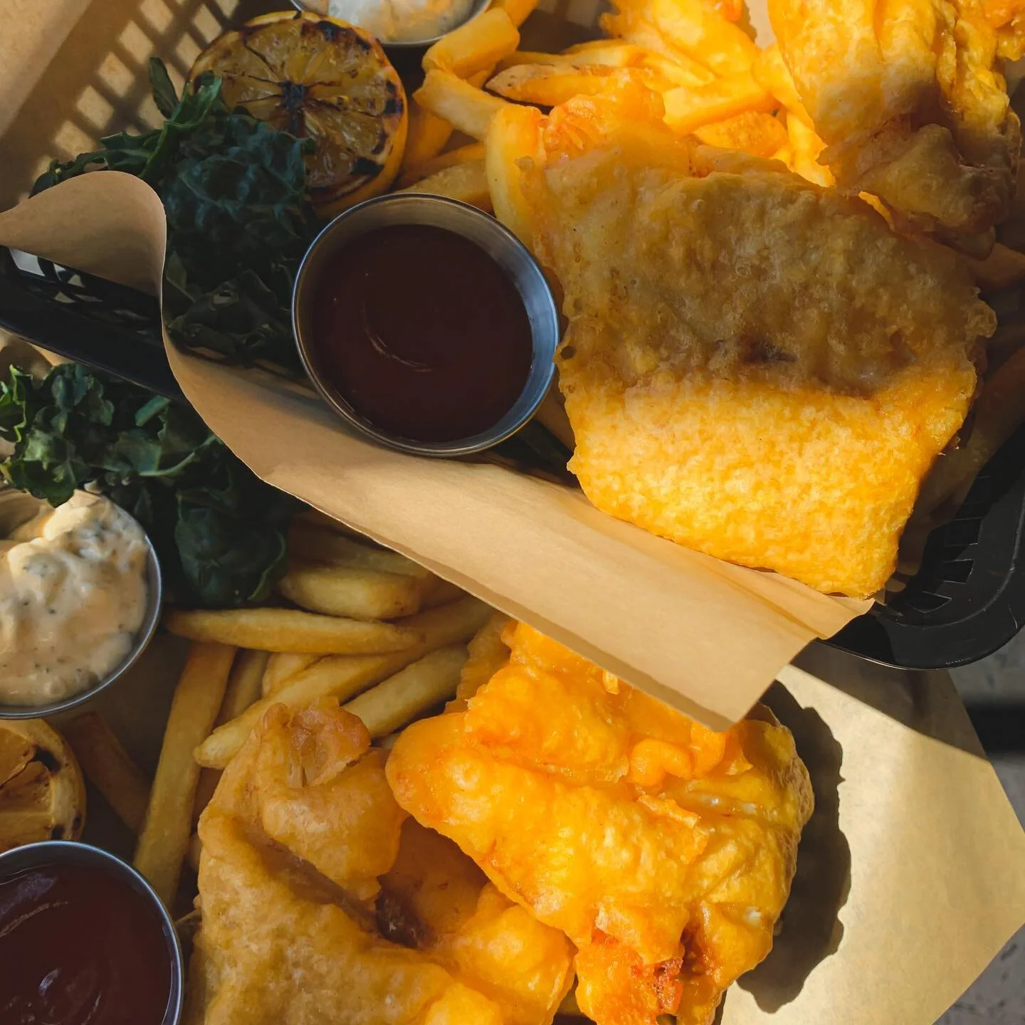 The sun is here ☀️ Come grab some lunch on the waterfront today!

Pictured: Alaskan Cod Fish &amp; Chips&hellip; also available on happy hour 🤫
