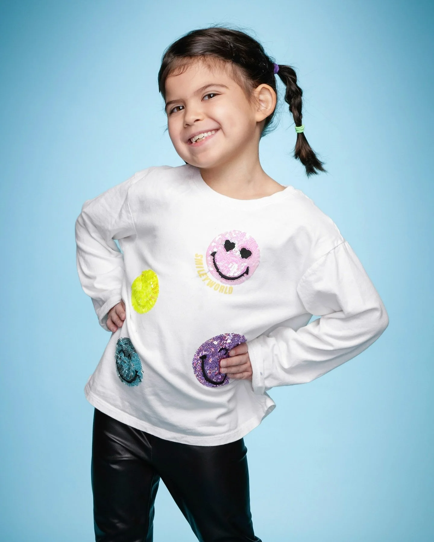 The smiley face you see everywhere started with Harvey Ball in 1963 as a way to lift spirits. These students wearing the smiley emojis remind us that happiness is contagious. So, let&rsquo;s celebrate kindness, joy, and good vibes by sharing smiles f