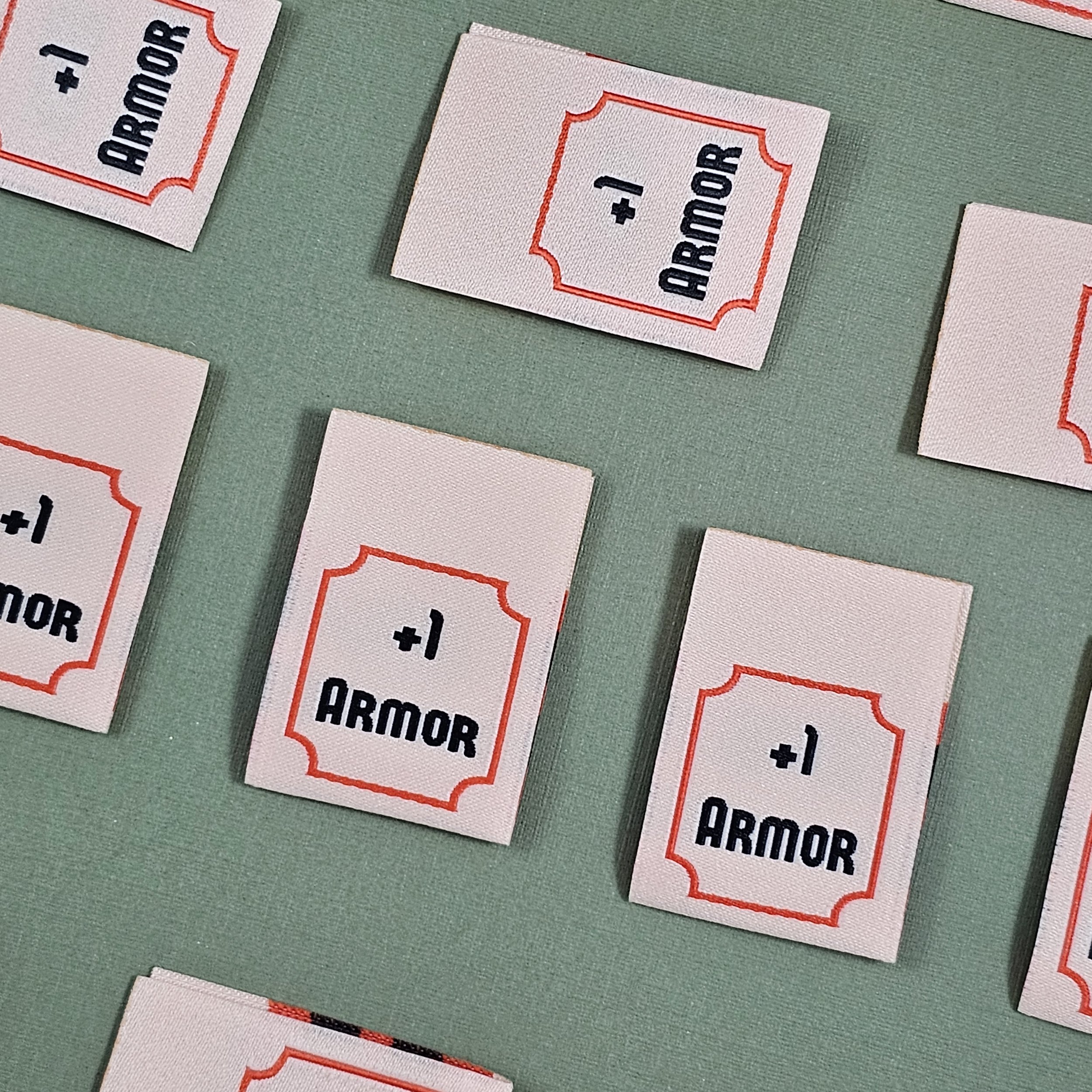+1 Armor Woven Label — The Fabric Treasury