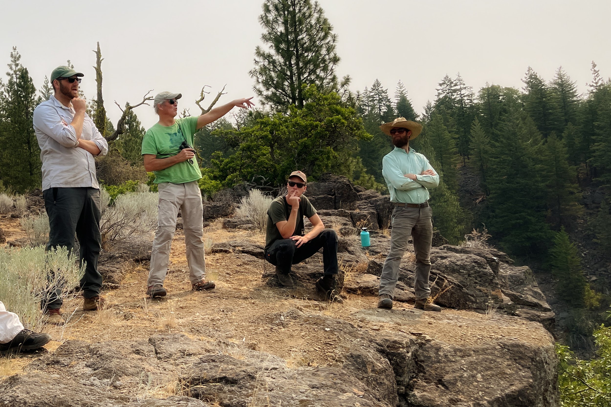 BLM Ecologist Charlie Schelz points across the overlook to the Jenny Creek restoration site below