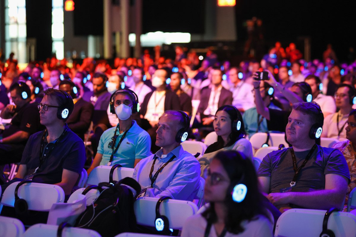 Corporate conference attendees engaged during executive panel session at the Amazon Web Services Summit at the Javits Center in New York City
