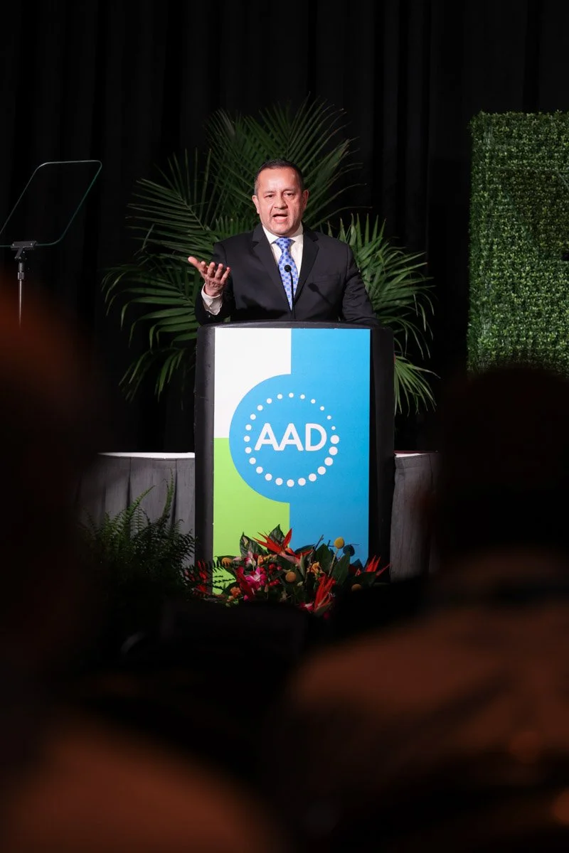 Keynote speaker presenting at a conference at the Boston Convention and Exhibition Center