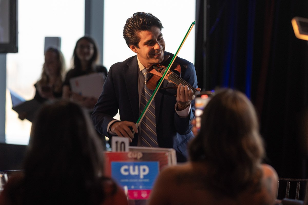 Violinist performing for guests at the CUP Gala at Mandarin Oriental in Manhattan