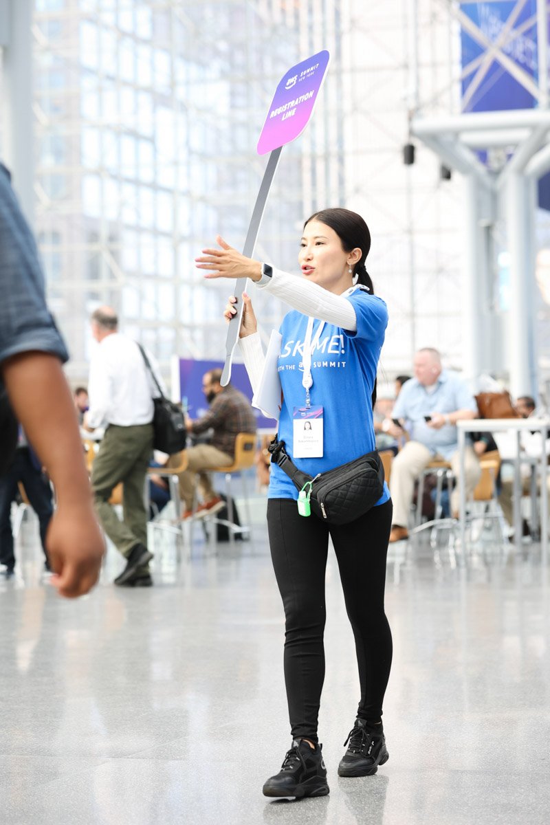 staff directing traffic at the busy Amazon Web Services Summit at the Javits Center in New York City
