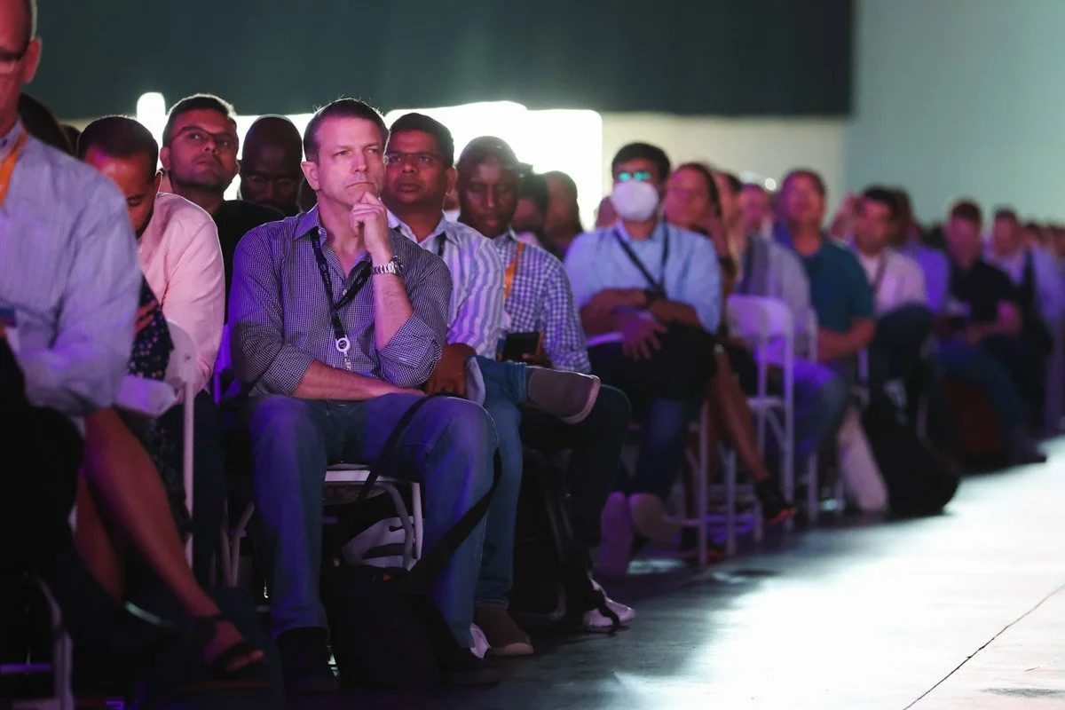 Engaged audience reacting to keynote panel discussion at the Amazon Web Services Summit conference in New York City