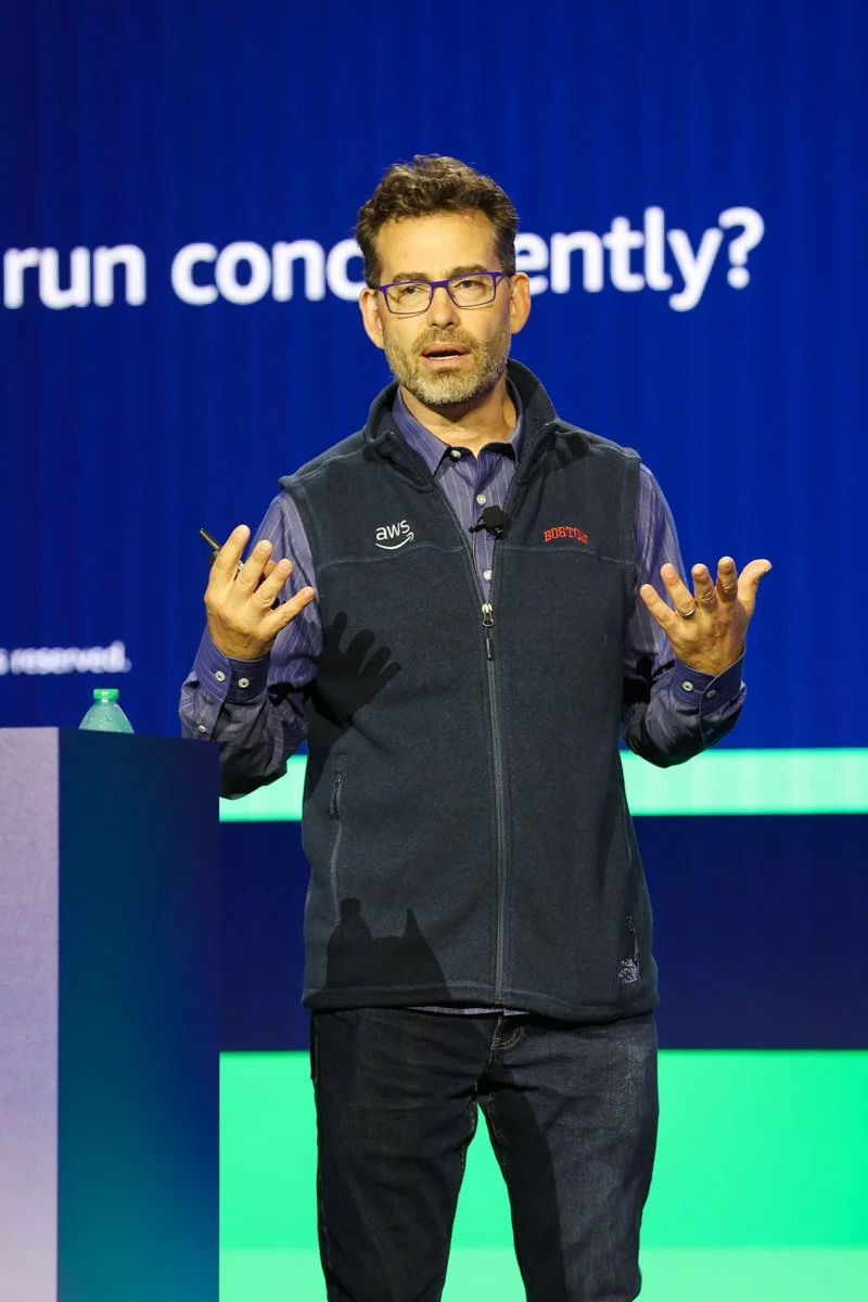 Industry leaders speaking on a panel at the Amazon Web Services Summit at the Javits Center in New York City