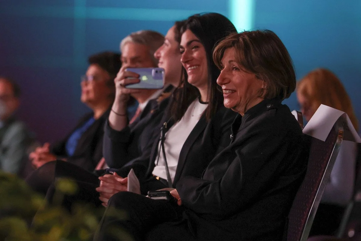 attendees engaged during executive panel session at the Boston Convention and Exhibition Center