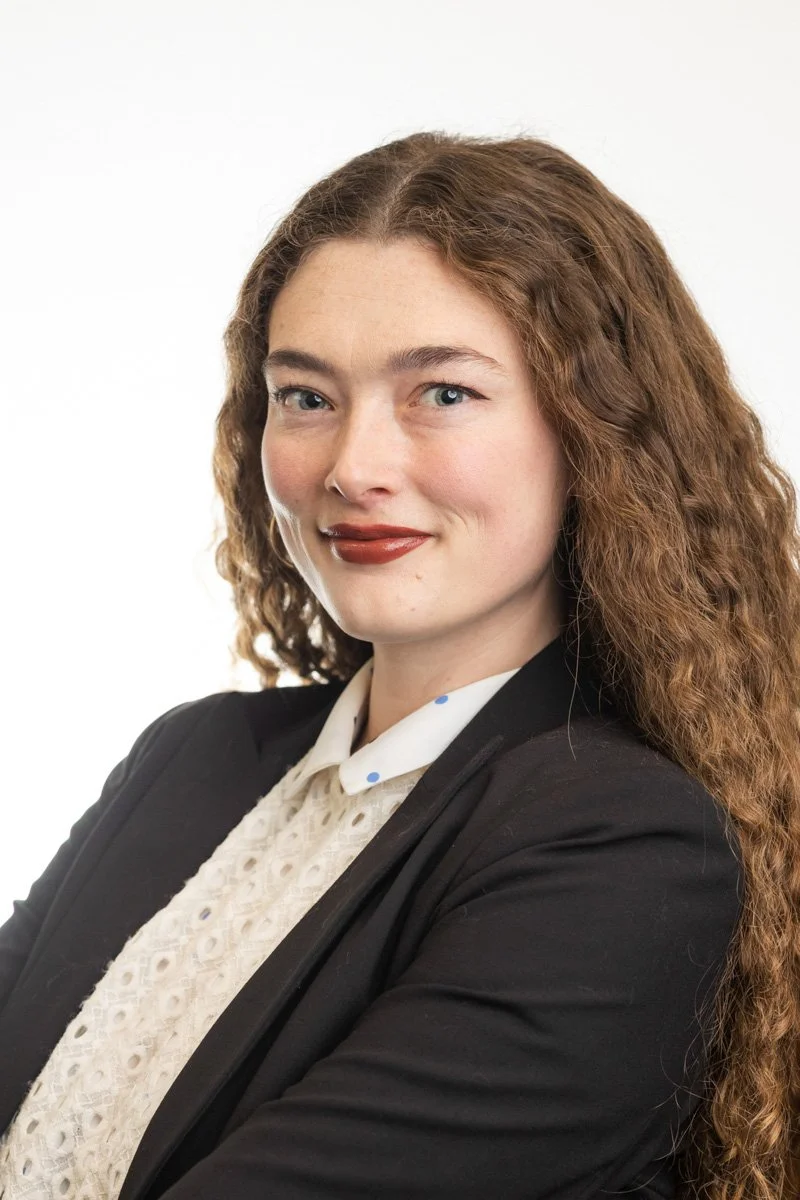 Professional corporate headshot of a woman executive photographed in New York City