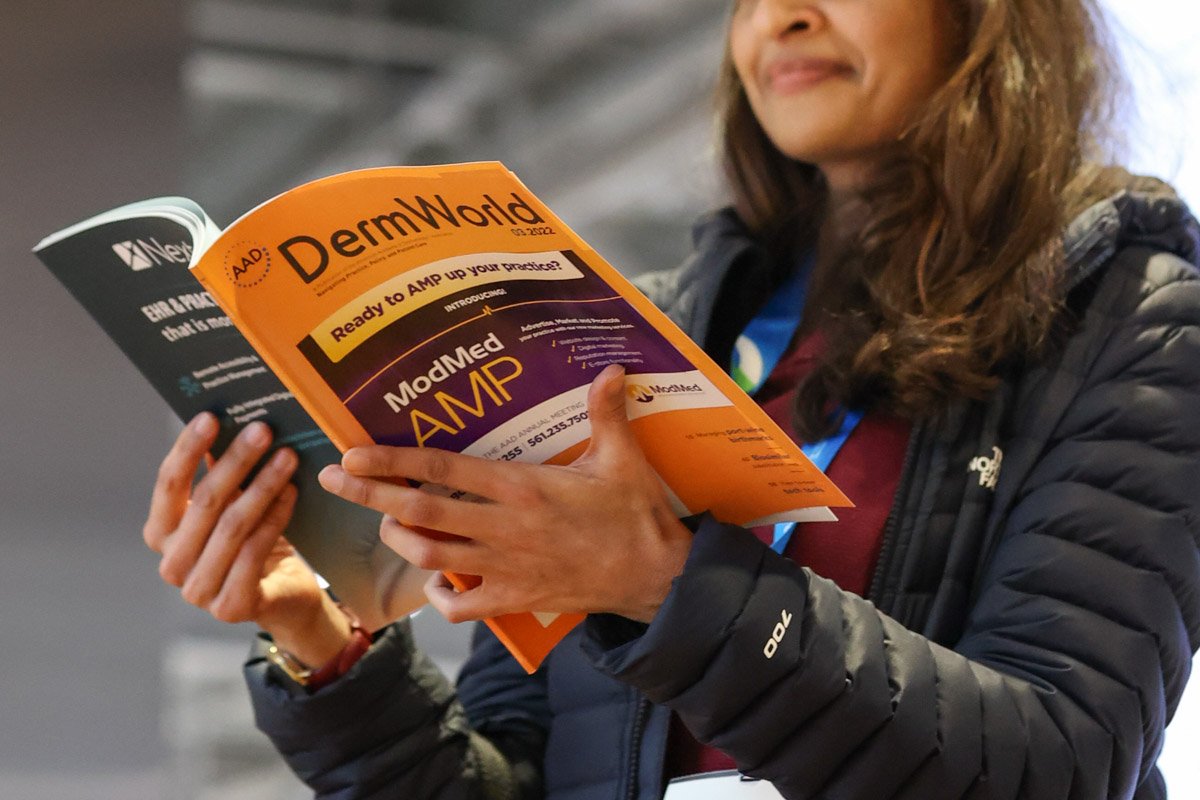 Guest reading a pamphlet at the Boston Convention and Exhibition Center