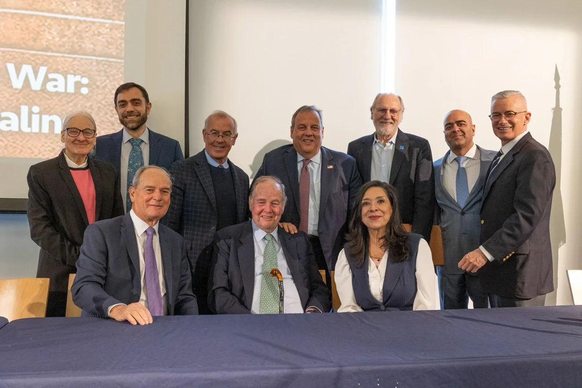 Speakers posing for a group photo at a nonprofit conference in jersey city