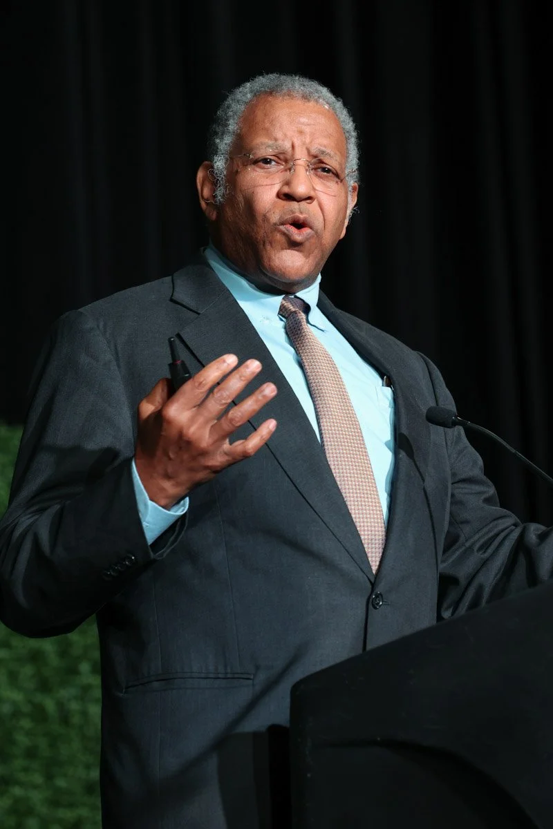 Keynote speaker presenting at a conference at the Boston Convention and Exhibition Center
