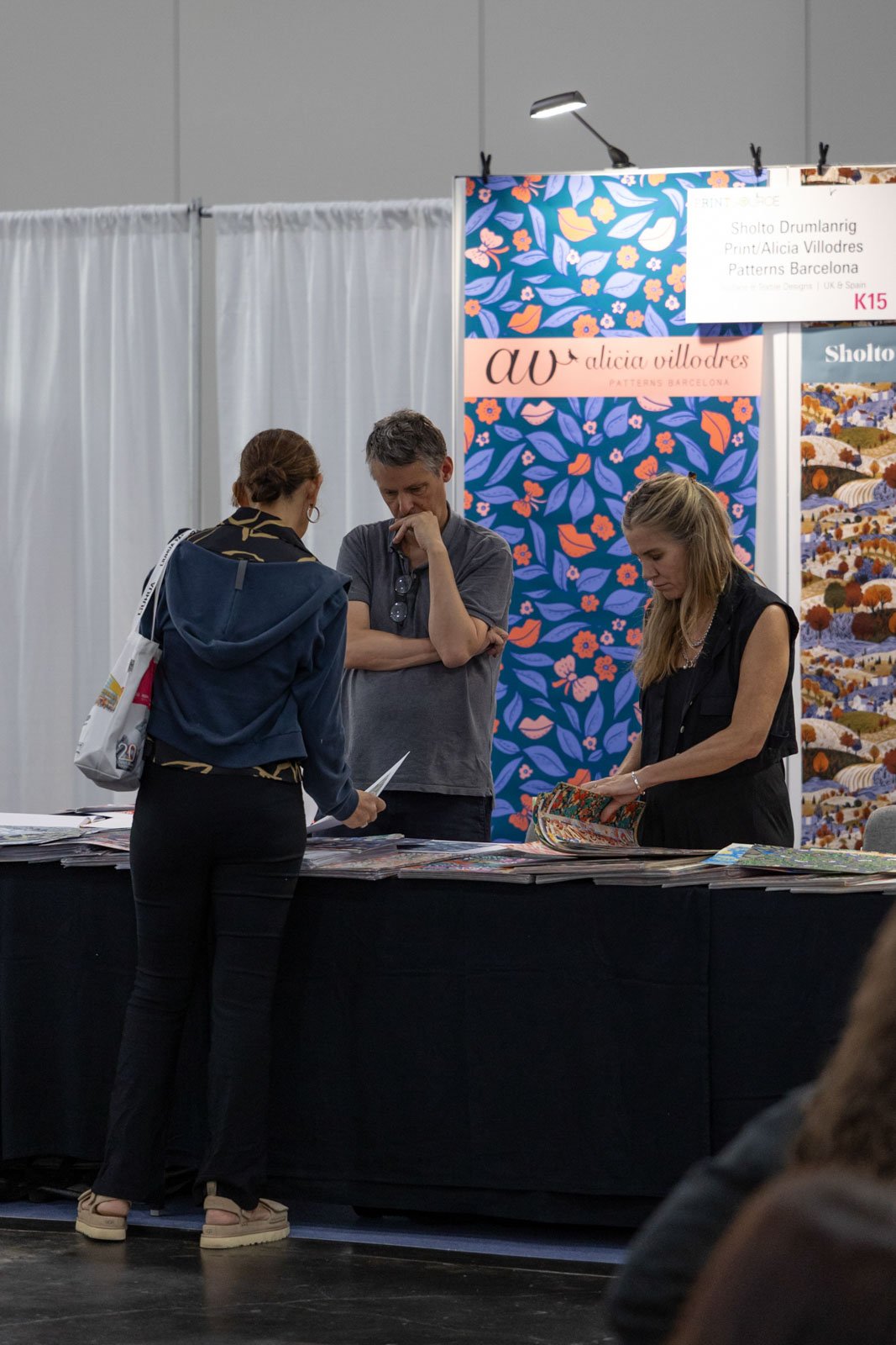 Texworld NYC attendees interacting with exhibitors at Javits Center