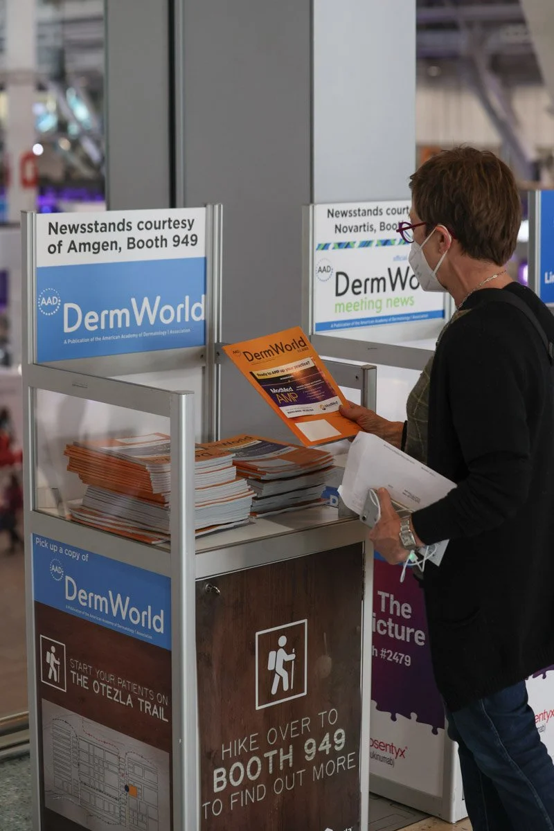 guest taking a pamphlet at the Boston Convention and Exhibition Center