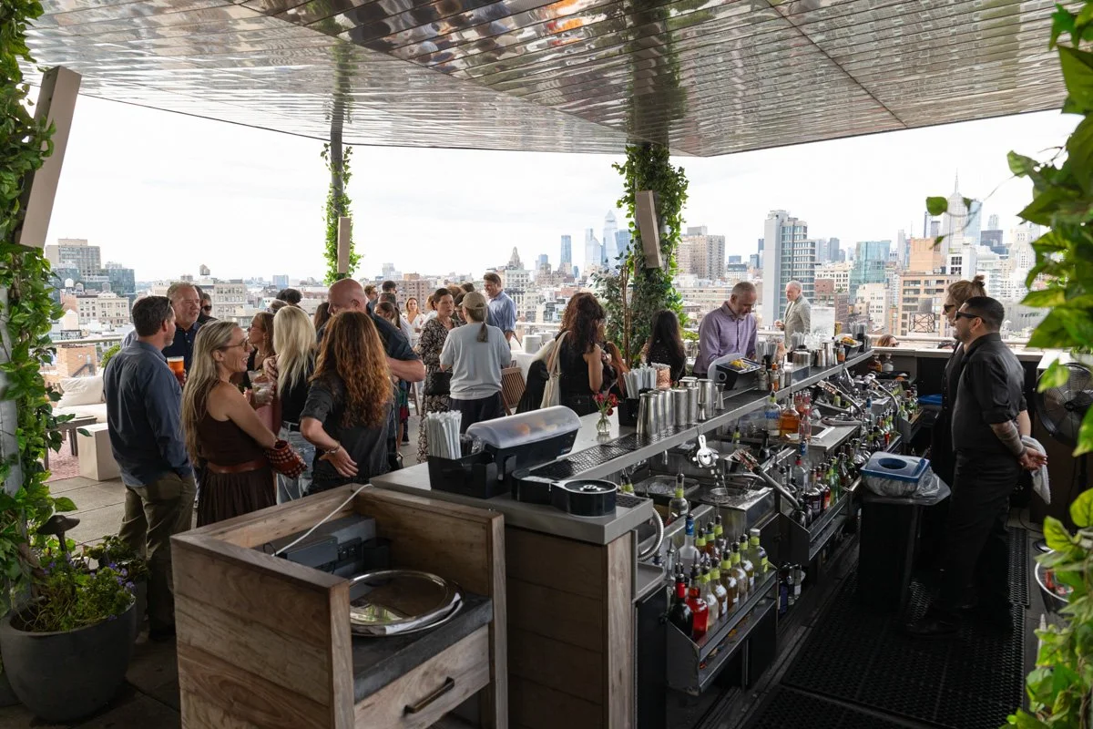 professionals ordering drinks at corporate reception in new york city