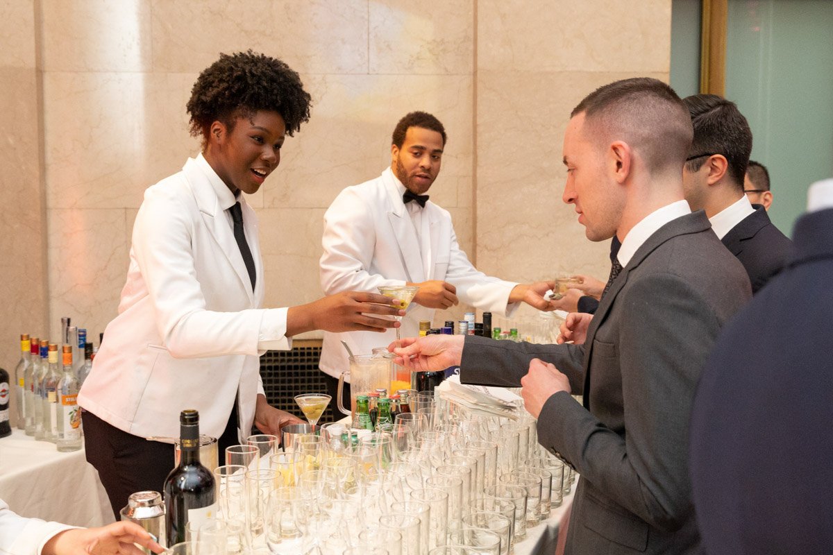 Bartenders serving cocktails to guests at the KACF Gala at Cipriani Downtown NYC