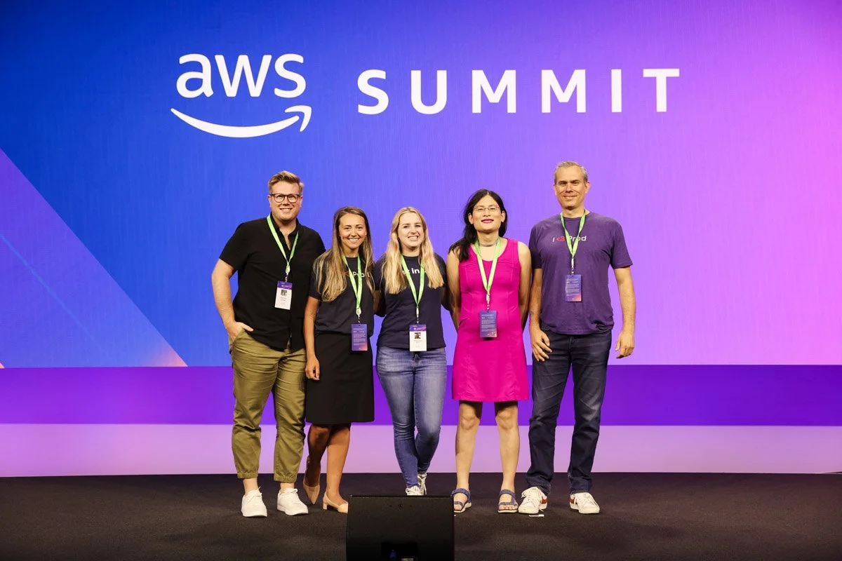 Industry leaders speaking on a panel at the Amazon Web Services Summit at the Javits Center in New York City