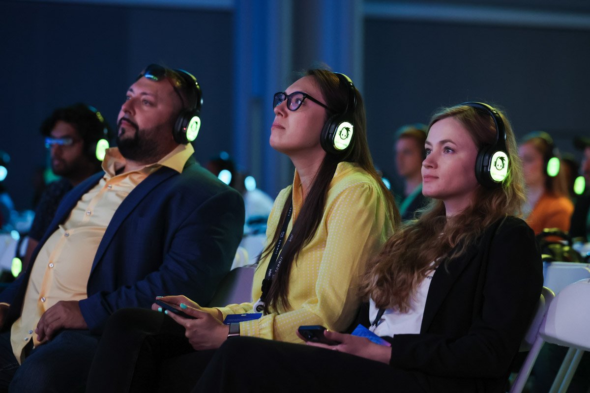 Corporate conference attendees engaged during executive panel session at the Amazon Web Services Summit at the Javits Center in New York City