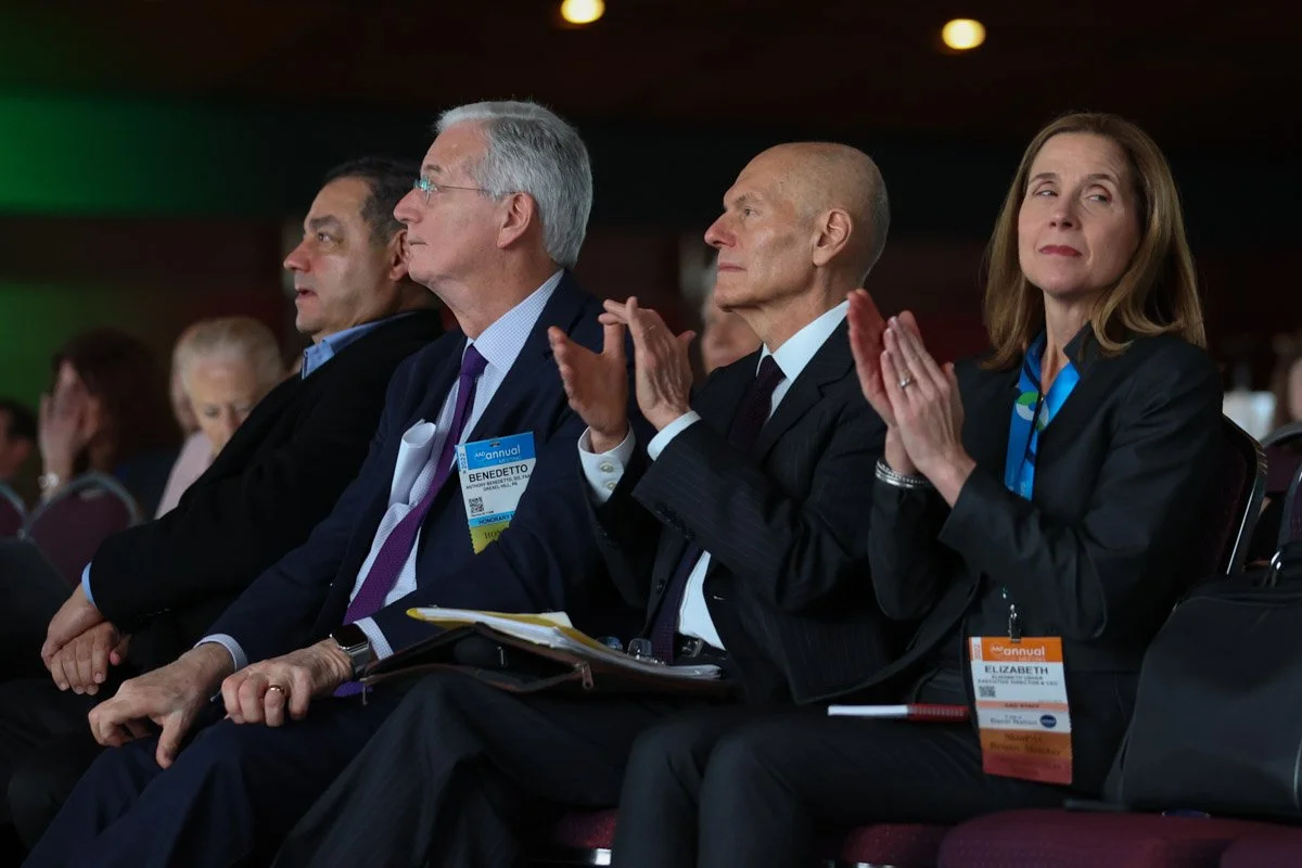 attendees clapping during a panel session at the Boston Convention and Exhibition Center