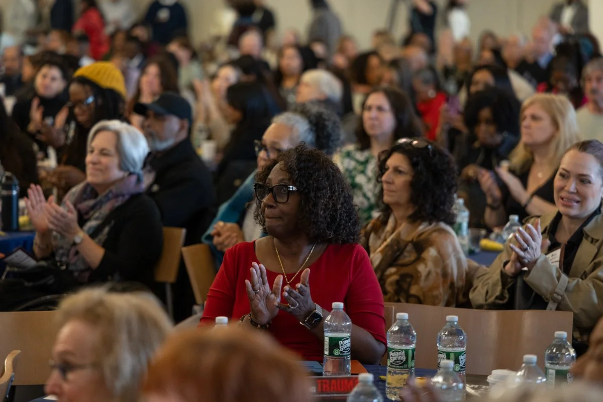 attendees clapping at a conference in new york city