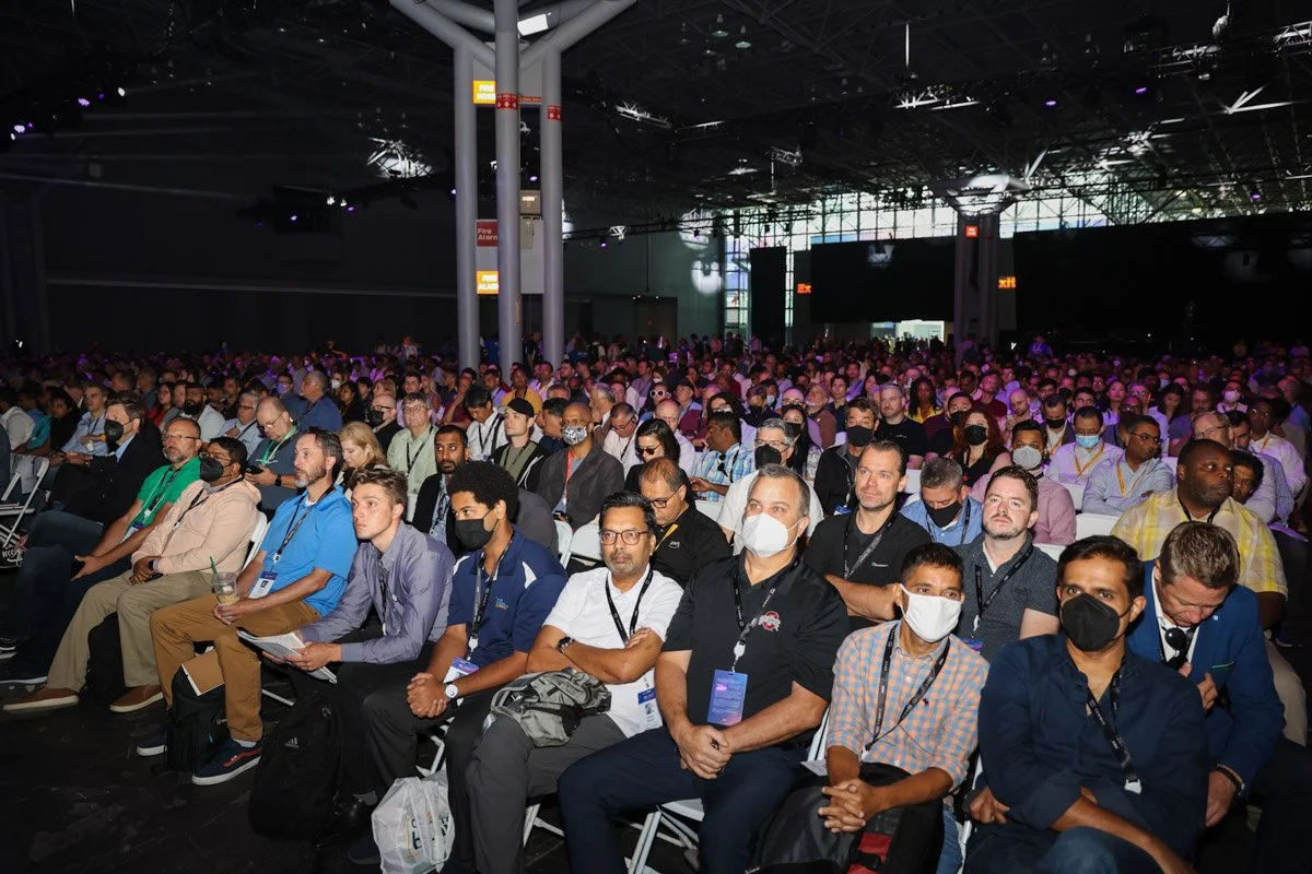 Engaged audience reacting to keynote panel discussion at the Amazon Web Services Summit conference in New York City