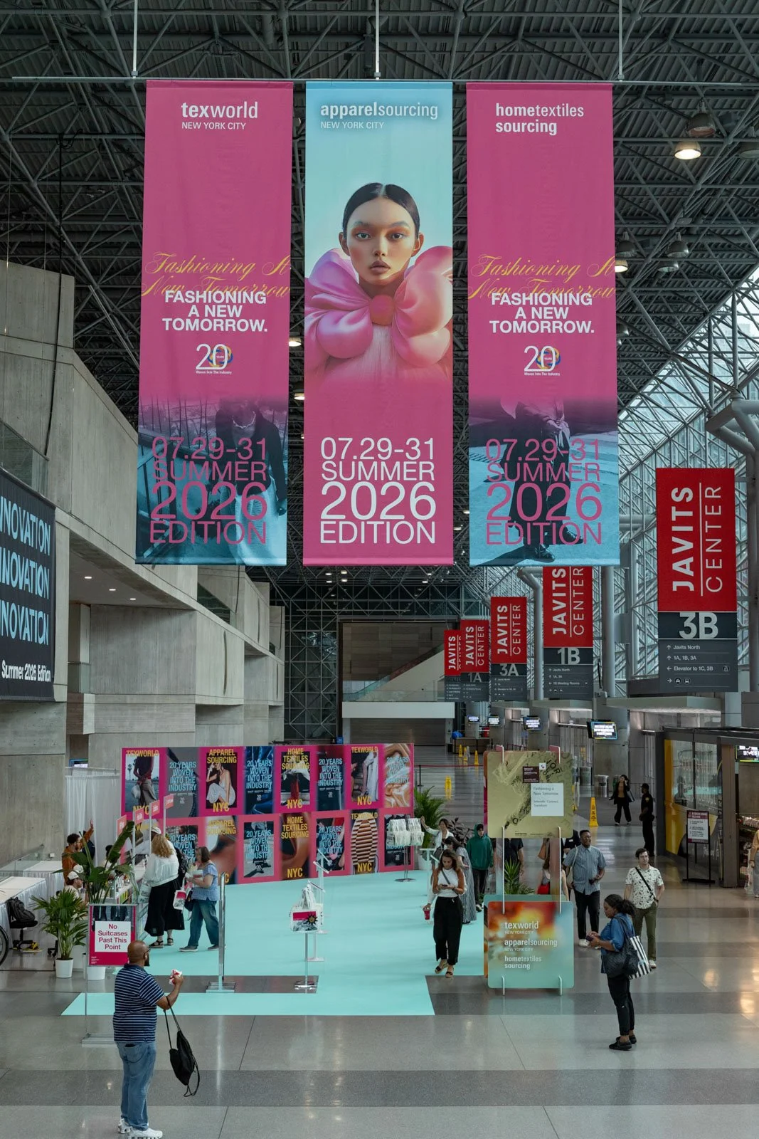 Texworld NYC registration hall with event banners at Javits Center