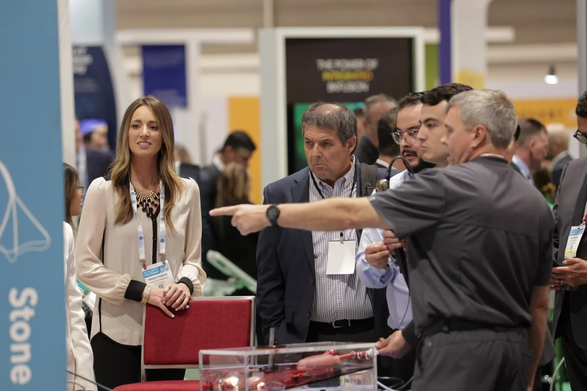 guests interacting in exhibit booths at the American Urological Association Meeting in the New Orleans Ernest N. Morial Convention Center 