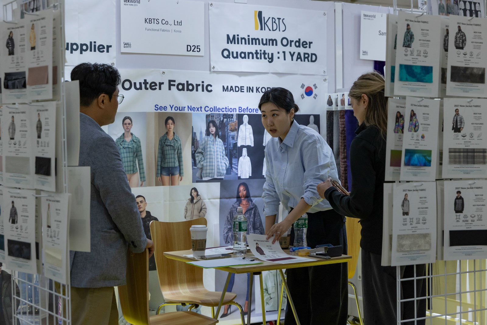 Texworld NYC attendees interacting with exhibitors at Javits Center