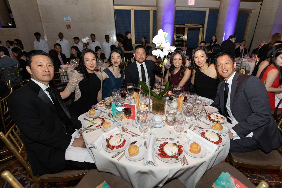 KACF Gala guests posing for a group photo at a table at Cipriani Downtown Manhattan